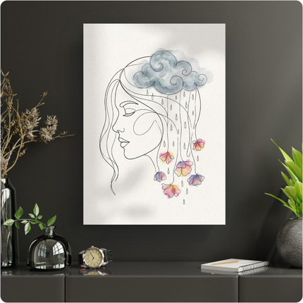 Affiche représentant un portrait de femme en line art, de profil, les yeux fermés. Au-dessus de sa tête, un nuage gris en aquarelle laisse tomber des gouttes qui se transforment en fleurs colorées aux teintes pastel (rose, jaune, violet, bleu) réalisées à l'aquarelle. Le fond de l'affiche est blanc. L'affiche est présentée sur un mur sombre, posée sur un meuble moderne avec des éléments de décoration végétale et une montre.