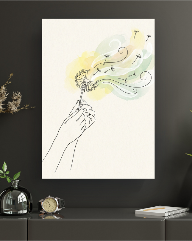 Affiche murale verticale représentant deux mains stylisées en line art noir tenant un pissenlit blanc dont les aigrettes s'envolent, portées par un vent symbolisé par des touches d'aquarelle jaune pâle et vert clair sur un fond crème texturé. L'ensemble évoque la légèreté et la nature.
